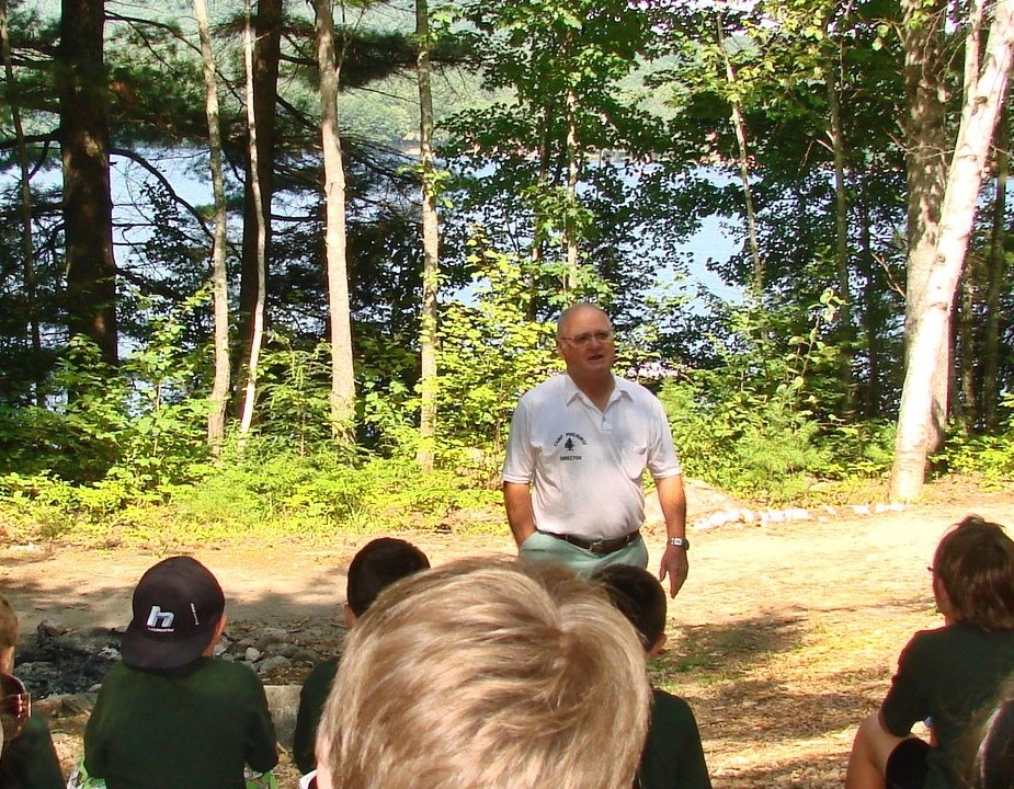Mr. Curtis addressing campers lakeside