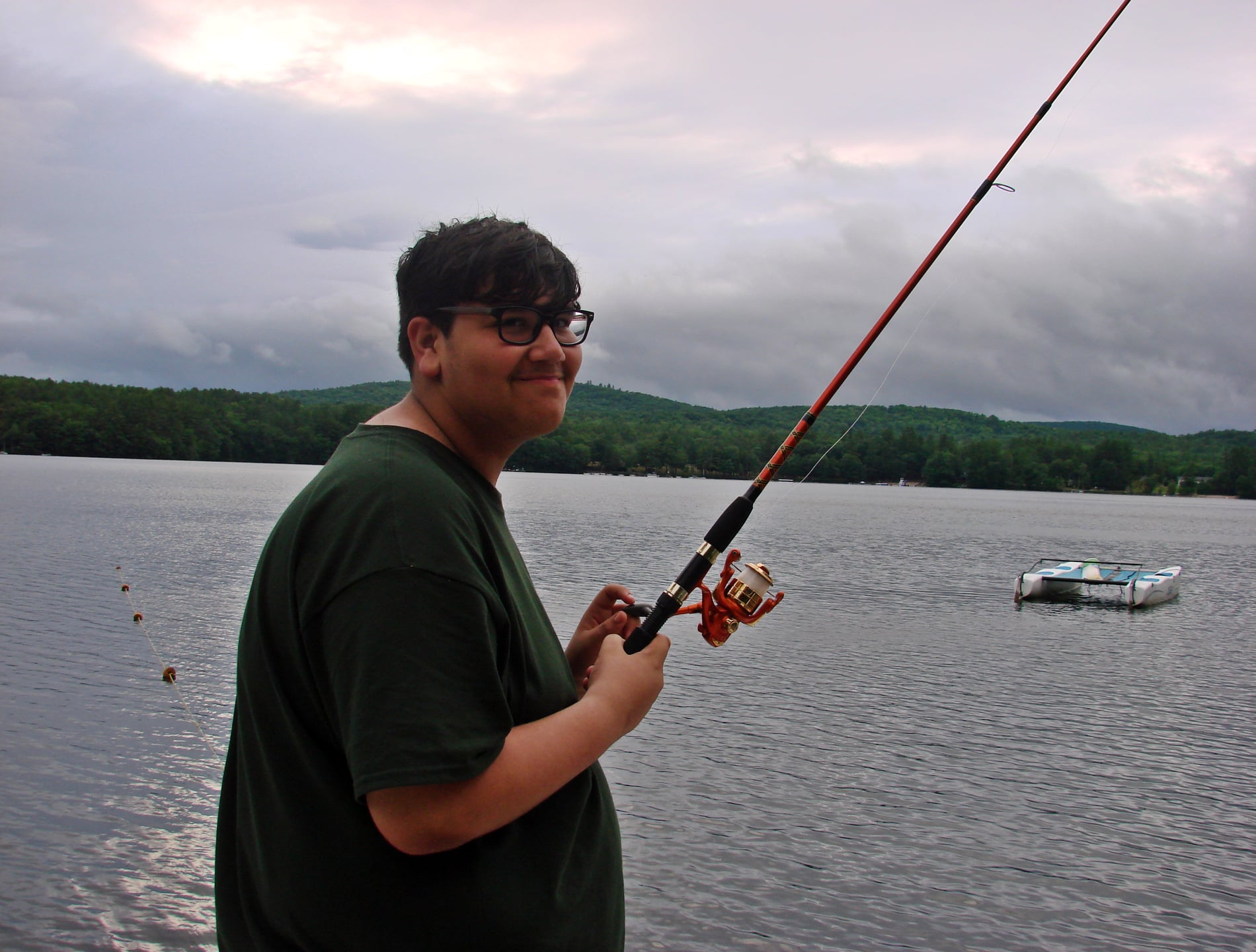 Kid fishing on Maine lake