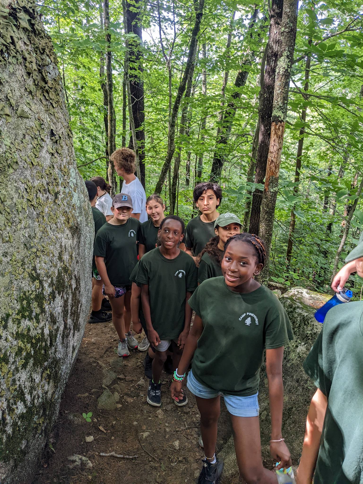 Kids hiking through Maine forest